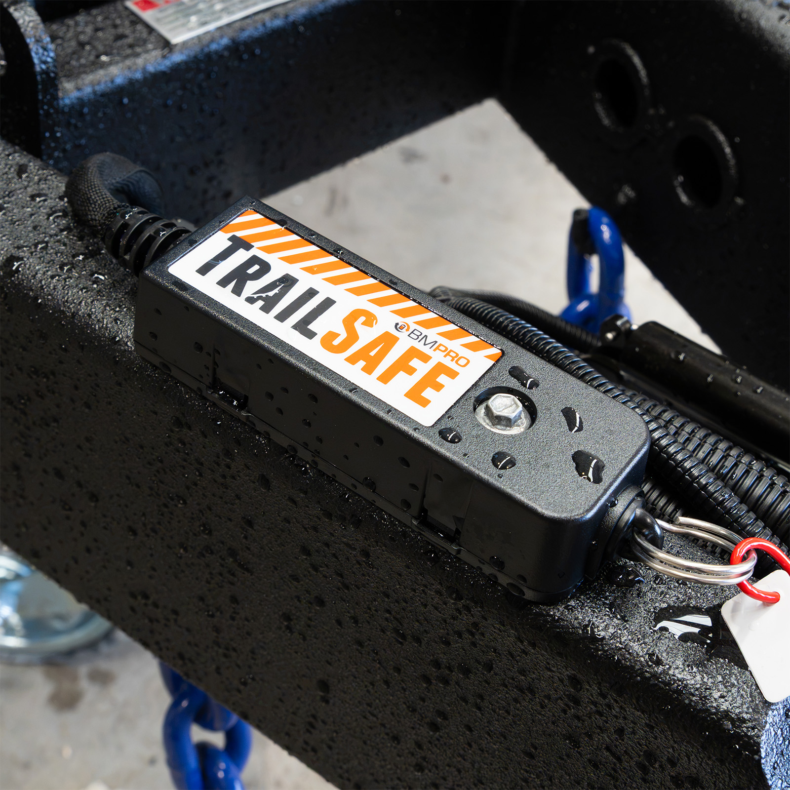 TrailSafe breakaway unit mounted on a trailer drawbar with its pull pin lanyard attached