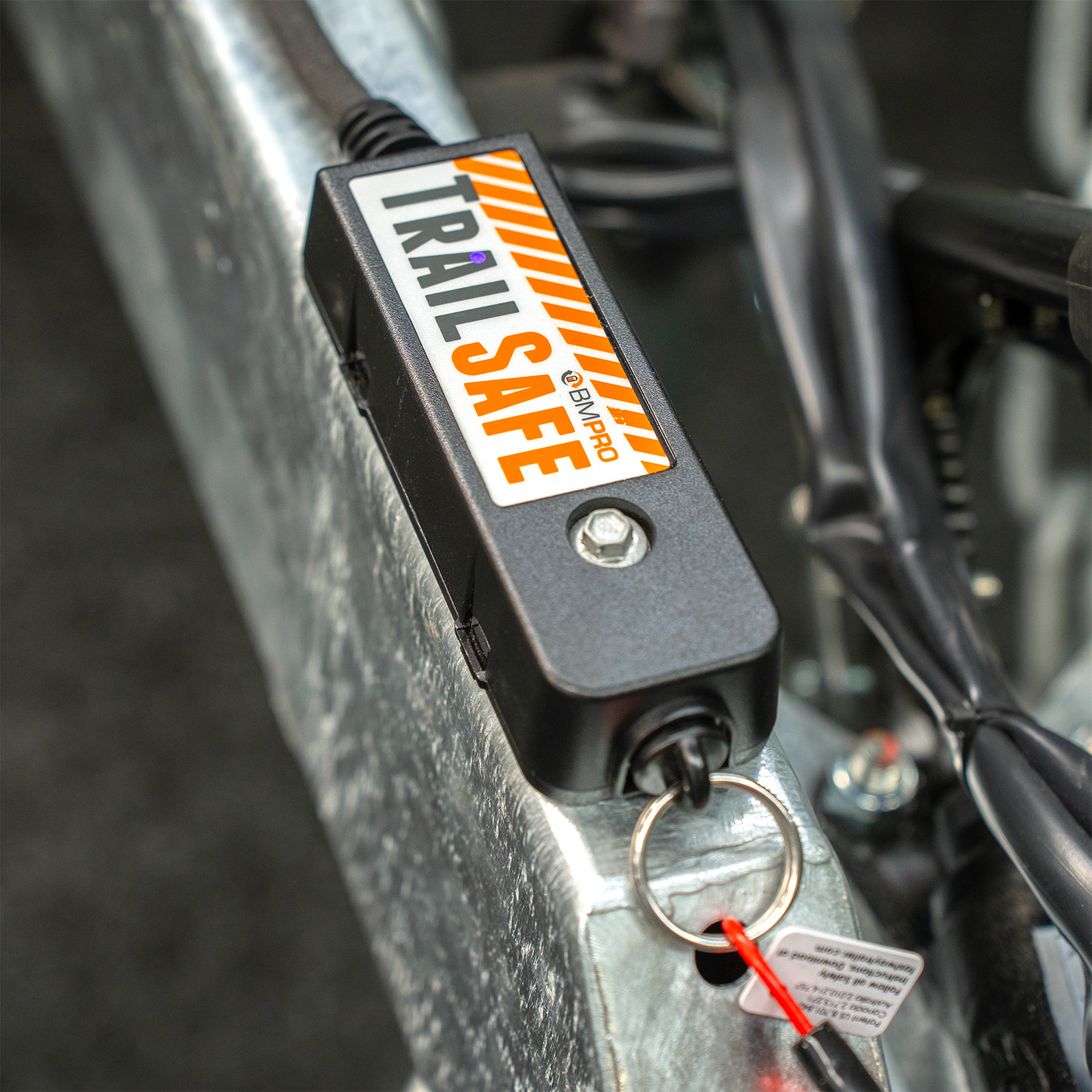 Close-up of a TrailSafe breakaway unit mounted on a galvanised trailer drawbar