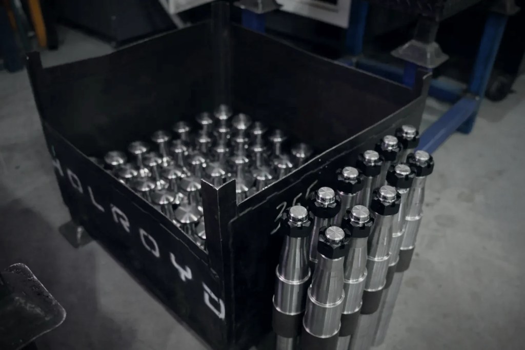 CNC machined stub axles in a Holroyd crate
