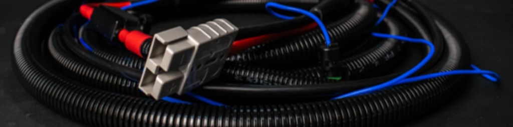 Starter battery to canopy loom with Anderson connector